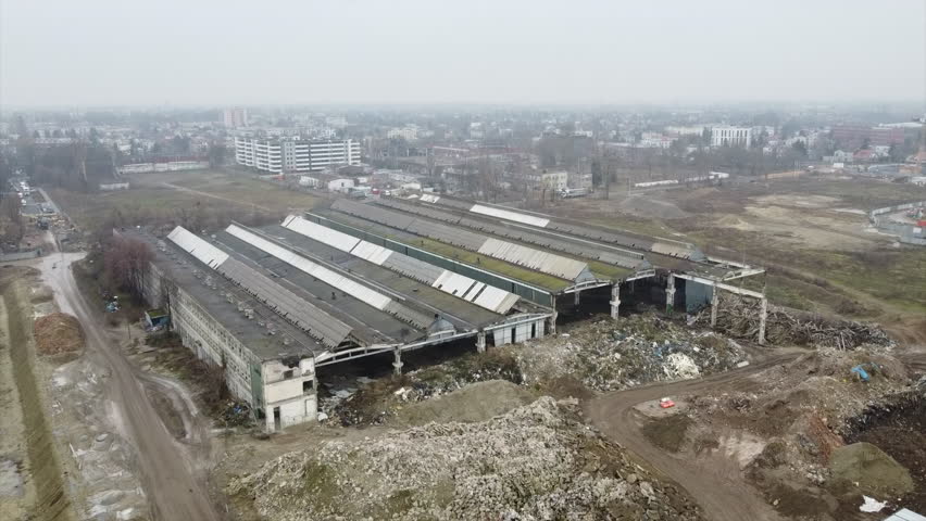 Abandoned and demolished production halls in an industrial area, the former tractor and machinery manufacturing plant halls in Warsaw’s Ursus district in Poland. 