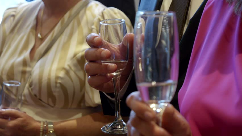 Wedding Celebration – Guests Holding Champagne Glasses