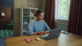 Asian woman worker remote hard work laptop home. Girl talk video call. Female employee virtual meeting. Busy ceo person use pc. Online education. Computer freelance conference. Distant job interview. - Powered by Shutterstock - Get 15% off with code: PIKWIZARD15