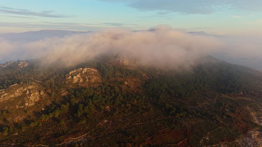 Clouds At The Rock Mountains Of Miradoiro Monte Louro In Galicia, Spain. Aerial Drone Shot