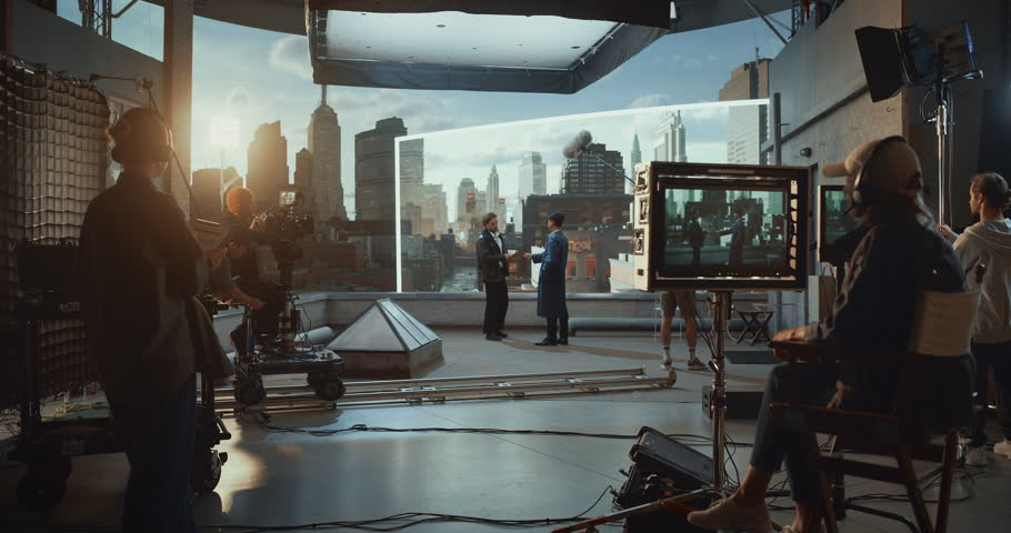 Professional Film Crew Shoots Rooftop Action Scene With Actors, Using Camera, Monitors and Virtual Production Led Screen. Detailed Behind‑the‑scenes Movie Production Studio Workflow