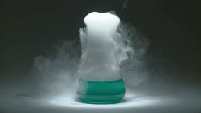 Chemical Experiment Beaker with Heavy Smoke - Science Laboratory Reaction Footage - Powered by Shutterstock - Get 15% off with code: PIKWIZARD15