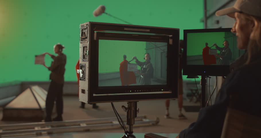 Film Crew Captures Caped Superhero on Futuristic Set, Using Chroma Key Green Screen to add Special Effects in Post Production. Female Director Supervises Innovative Blockbuster Action Sequence
