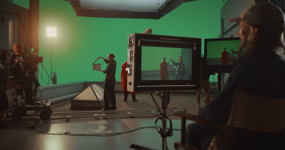 Professional Film Crew Records Caped Superhero Sequence on Green Screen Chroma Key Stage, High Tech Director Crafts Dramatic, Cinematic Framing for Visually Striking, Innovative Blockbuster Movie