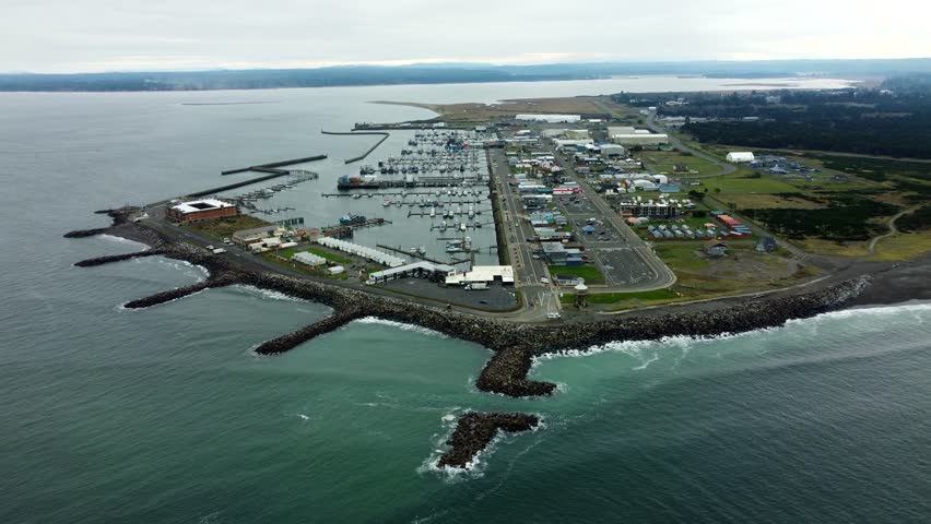 US, WA, Westport, 2025-10-28 - Drone view of the harbor with ships, rocks, buildings, fishing, bay
