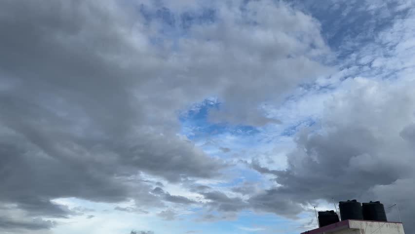 Scenic view of beautiful clouds from a terrace with birds flying