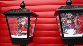Christmas lanterns with Santa and snowman on red - Powered by Shutterstock - Get 15% off with code: PIKWIZARD15