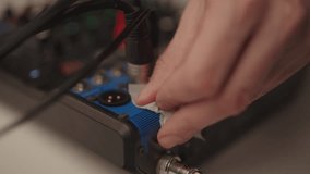 Cleaning service employee cleaning audio mixing console with microfiber cloth, performing routine maintenance on sound equipment to preserve functionality and audio quality in home studio slow motion. - Powered by Shutterstock - Get 15% off with code: PIKWIZARD15