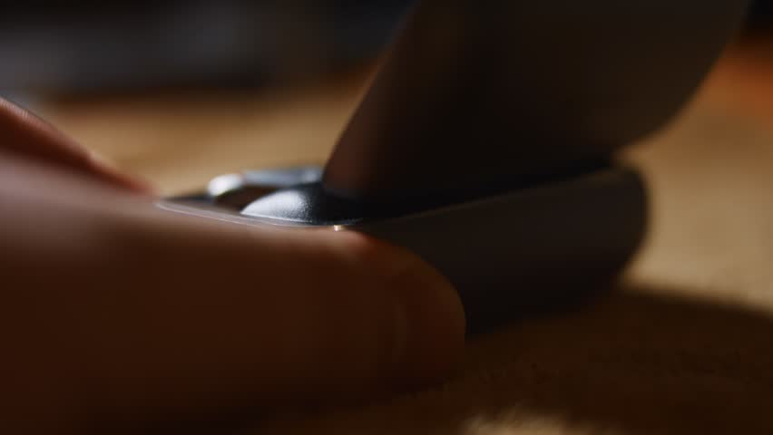 Hand puting the wireless earphones into the case and then closing it for charging