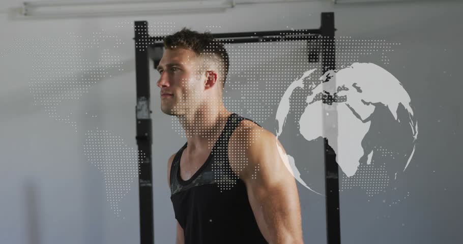 Athlete turning to camera as globe overlay sweeping starting pose, crossing arms showing fitness. Gym, athletic, strength, masculine, confident, world, graphic