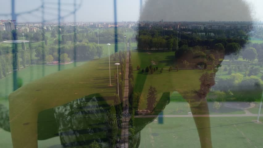 Adult woman leaning on glass and lowering head, starting overlay revealing park walkway for design. Window, reflection, urban, skyline, daytime, fashion, contemplative