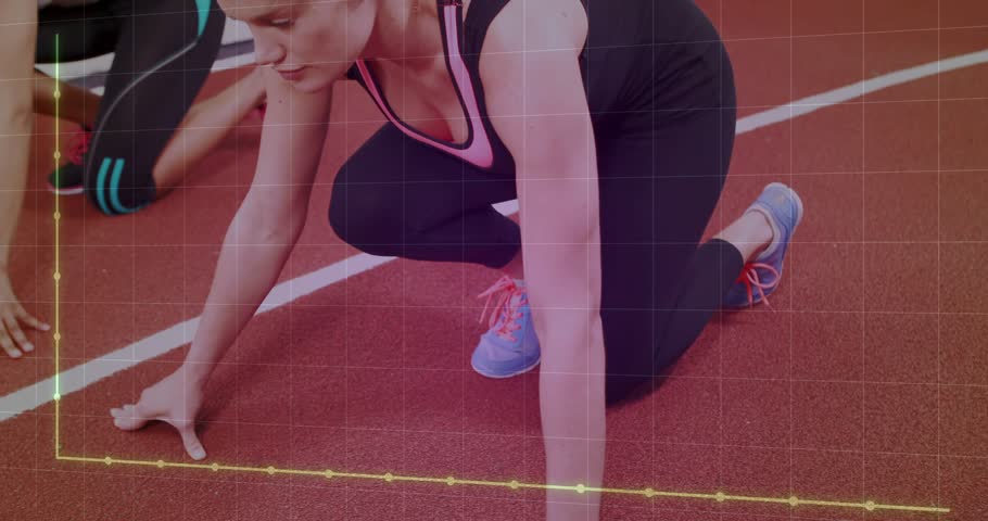 Two women pushing off from low crouch, sprinting down track while training graph tracking steps. Athletes, sprint, velocity, facility, cardio, workout, windows