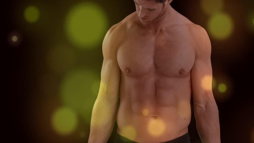 Fitness model looking down at dumbbells doing steady curls as bokeh drifts showing muscles for tone. Weights, strength, focus, athletic, studio, silhouette, chrome