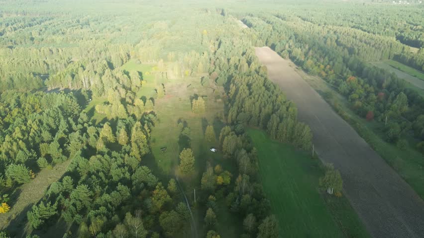 Scenic aerial farmland with autumn trees and fields
