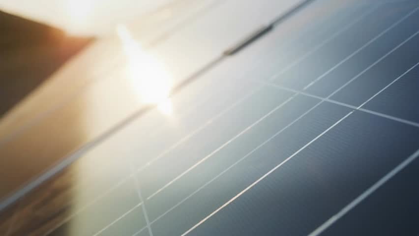 Hand interacting with solar panel graphics, illustrating renewable energy, sustainable technology, and eco-friendly power solutions.