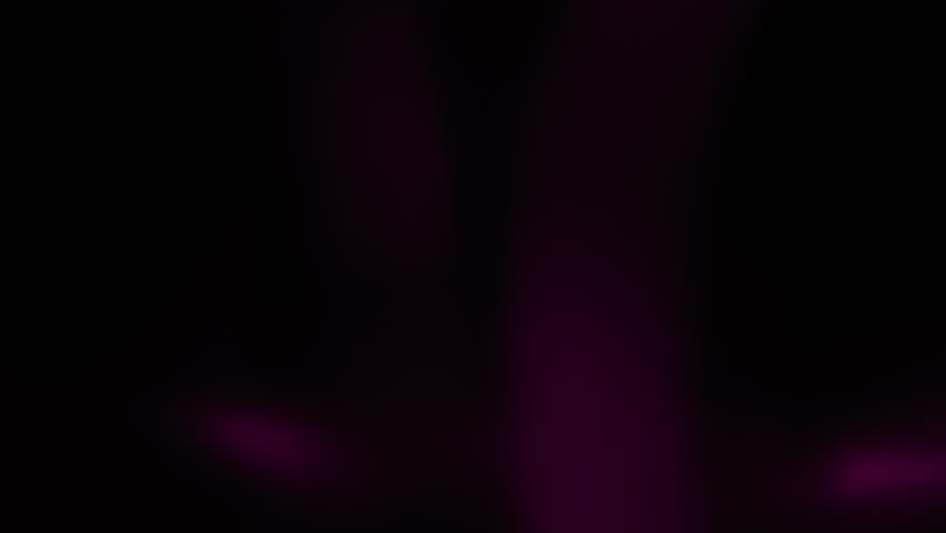 Purple shapes morphing and flashing on dark background 