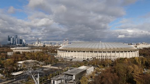 Drone Pulling Back over Large City Stadium