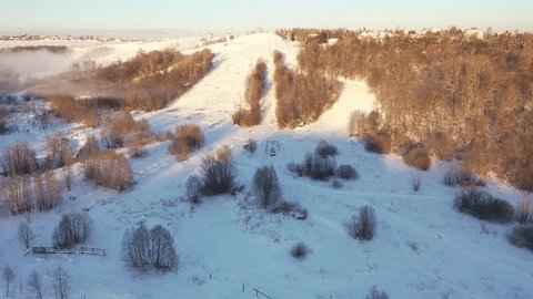 Drone Flying Forward over Snowy Ski Resort