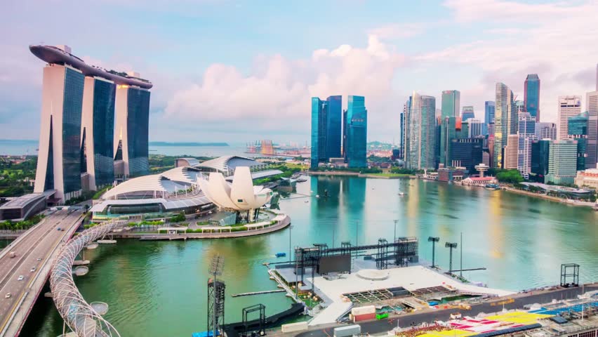 Aerial view of Singapore bay area skyline, showcasing downtown district, hotels, financial buildings, and scenic nature along the vibrant waterfront.