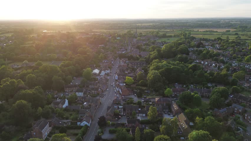 aerial view of Repton in Derbyshire, revealing the historic village layout, surrounding countryside, rooftops, roads, and green spaces within the rural English landscape