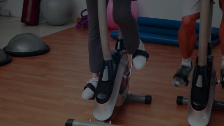 Waveform appearing, three riders pedaling bikes, cadence rising then steadying to show group rhythm. Cycling, stationary, gym, fitness, workout, cycles, motion