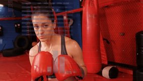 Female boxer training in boxing gym guarding cueing straight punch shifting hooks HUD tracking data. Athlete, workout, focus, determination, motion, cardio, equipment - Powered by Shutterstock - Get 15% off with code: PIKWIZARD15