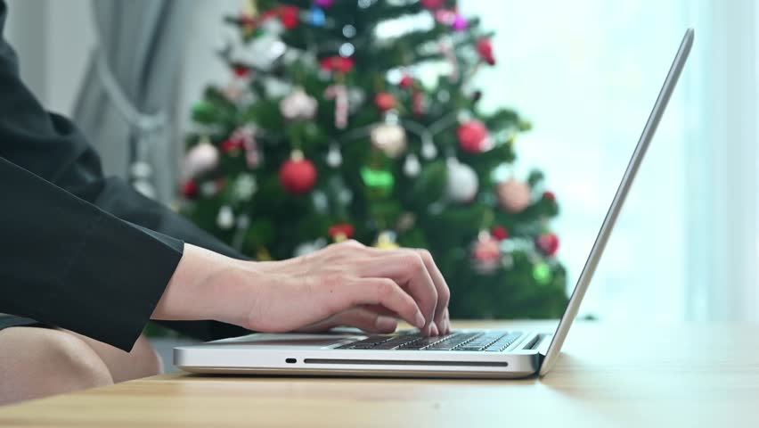Cropped shot view of business woman hands while typing on laptop computer.
