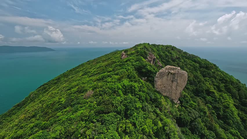 Tropical beaches, turquoise waters, and lush island landscapes of Con Dao, Vietnam. Aerial coastal scenery showcasing untouched nature and serene Southeast Asian beauty.