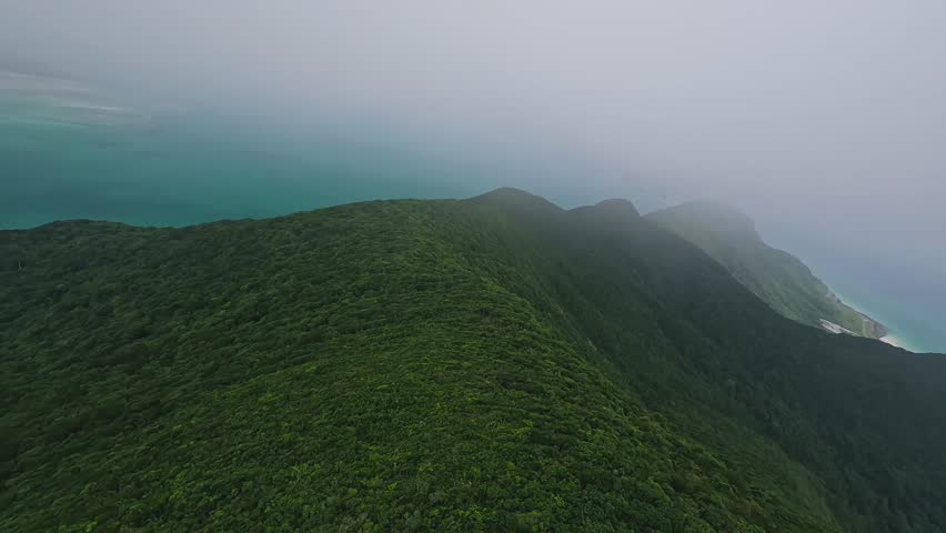 Tropical beaches, turquoise waters, and lush island landscapes of Con Dao, Vietnam. Aerial coastal scenery showcasing untouched nature and serene Southeast Asian beauty.