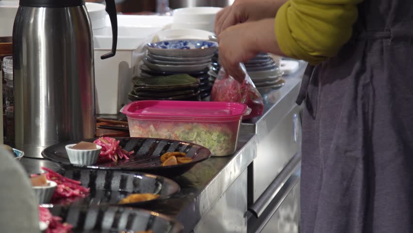 Image of a woman preparing a meal