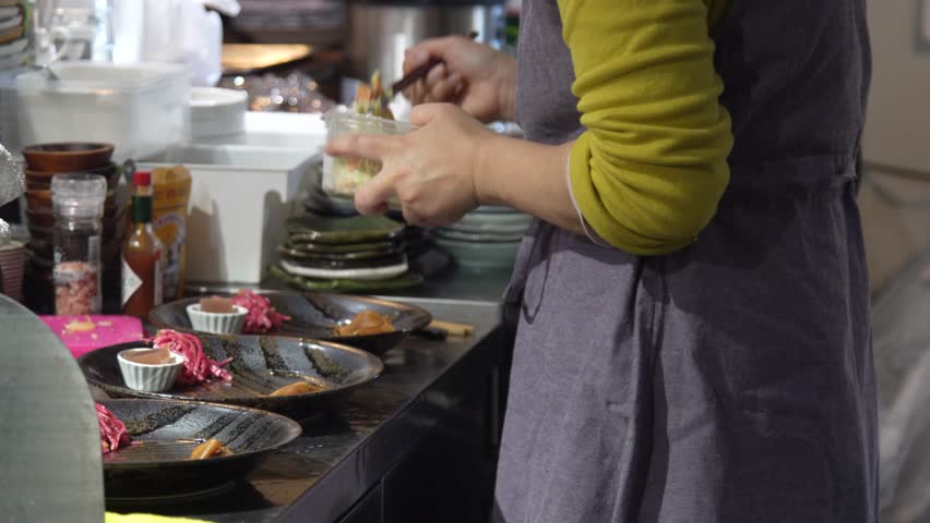 Image of a woman preparing a meal