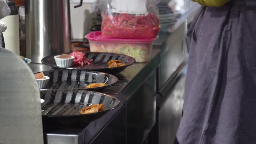 Image of a woman preparing a meal