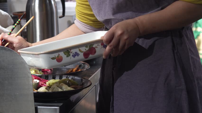 Image of a woman preparing a meal
