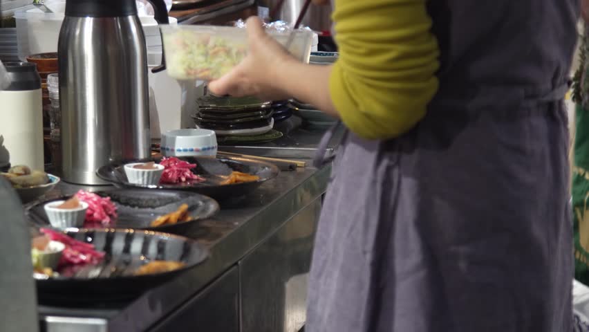 Image of a woman preparing a meal