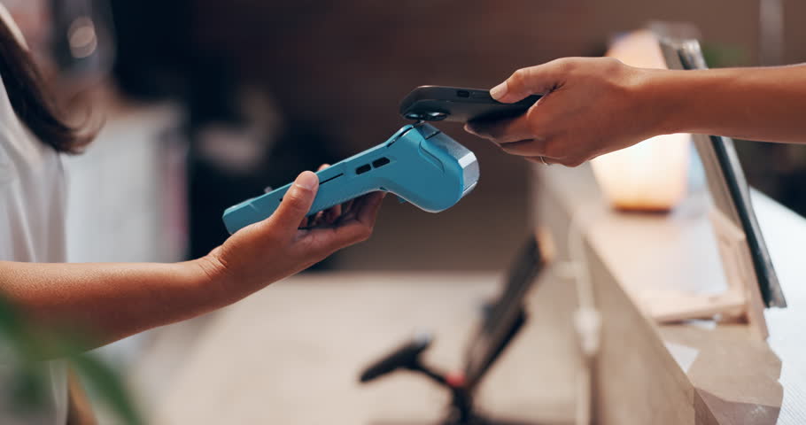 Person, hands and pos machine with phone for payment, fintech or wireless transaction in shop. Closeup, people or customer paying with mobile smartphone, scan or NFC for banking or checkout in store