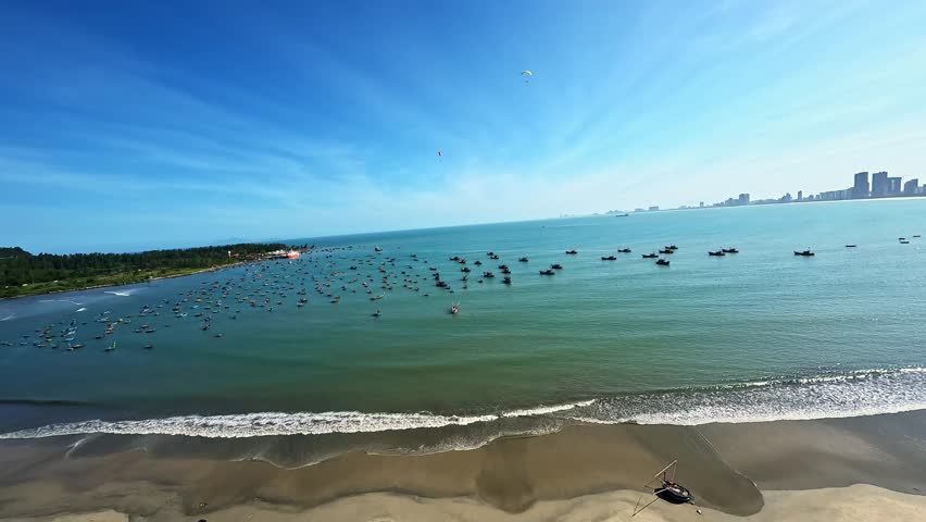 Dynamic FPV drone footage of Da Nang, Vietnam, featuring Dragon Bridge, boats on the Han River and the Lady Buddha statue on Son Tra Peninsula with city and coastal scenery.