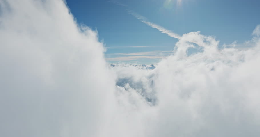 Aerial drone fly through white fluffy clouds part reveal bright blue sky. Perfect for travel or nature themes. Natural background, nature landscape