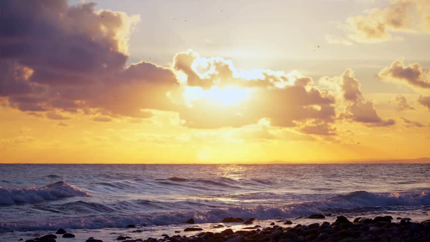 Sun behind the clouds at the beach 4k