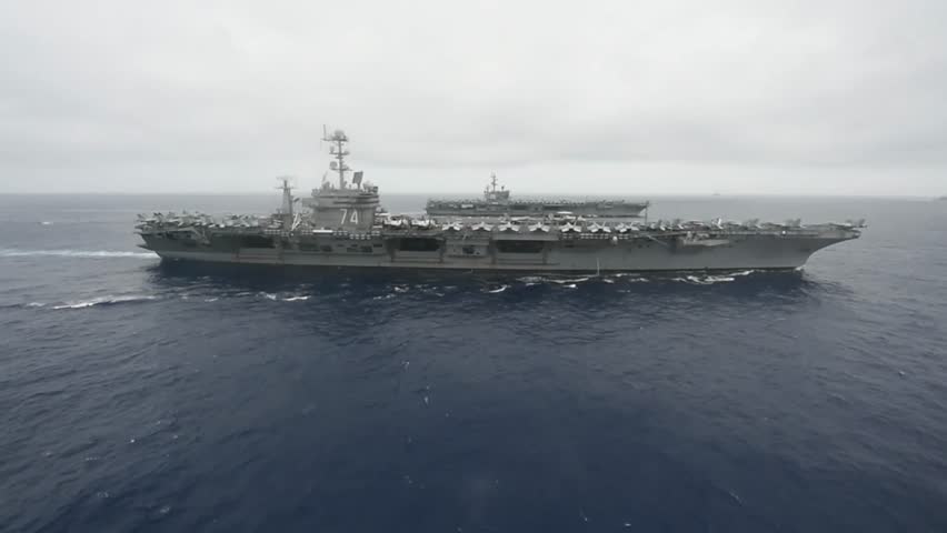 The aircraft carriers USS John C. Stennis (CVN 74) and USS Ronald Reagan (CVN 76) conduct operations