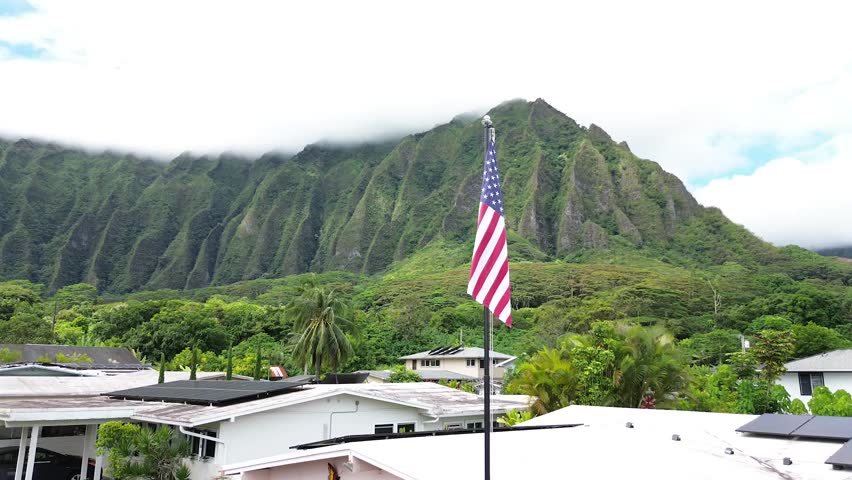 Aerial Shot of a US Flag Flying near the Diamond Head Crater in Honolulu