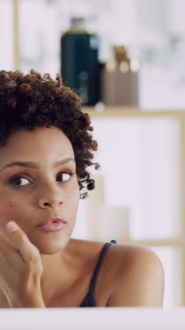 Eyebrow, beauty and woman in bathroom in home with self care, grooming or wellness by mirror. Cosmetics, reflection and female person checking facial hair with getting ready in morning at house.