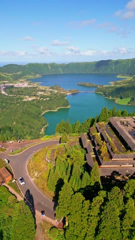 Sao Miguel, Azores, Portugal: The famous view of the Twin Lakes (Lagoa das Sete Cidades) with different colors inside a volcanic crater, seen from the Vista do Rei viewpoint (King