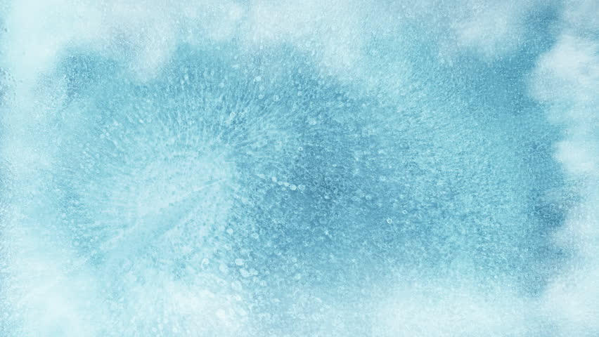 Super Slow Motion Shot of Freezing Ice Texture and Gently Flowing Cold Smoke at 1000fps.