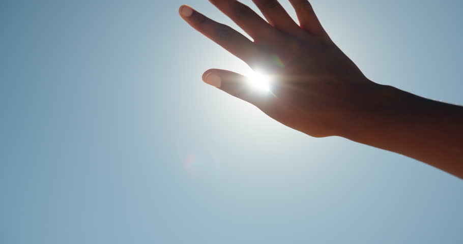 Blue sky, outdoor and hand of person with sunshine, block glare and shade eyes for protection from intense light. Vision support, uv rays and woman cover to prevent sunburn, mockup space and flare