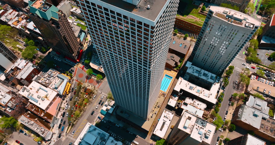 Footage at the skyscraper with a pool nearby. Aerial perspective on the scenery of Chicago, Illinois, USA.