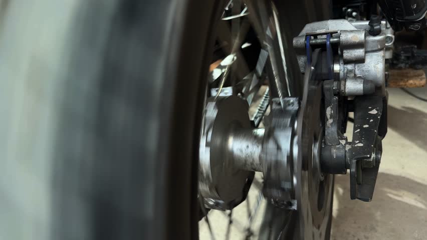 the motorcycle wheel is spinning