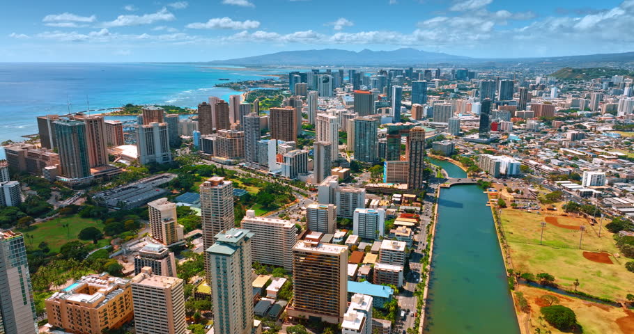 Fantastic scenery of Waikiki outlined by Ala Wai Canal. Drone flight over beautiful Honolulu, Hawaii, USA.