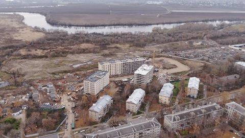 Drone Rising Backward over Urban Landscape