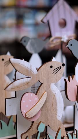 Easter sale. Different funny Easter bunny figurines, statuettes. shopping of Easter decoration for home. Easter decorations and gifts in the shop, supermarket.