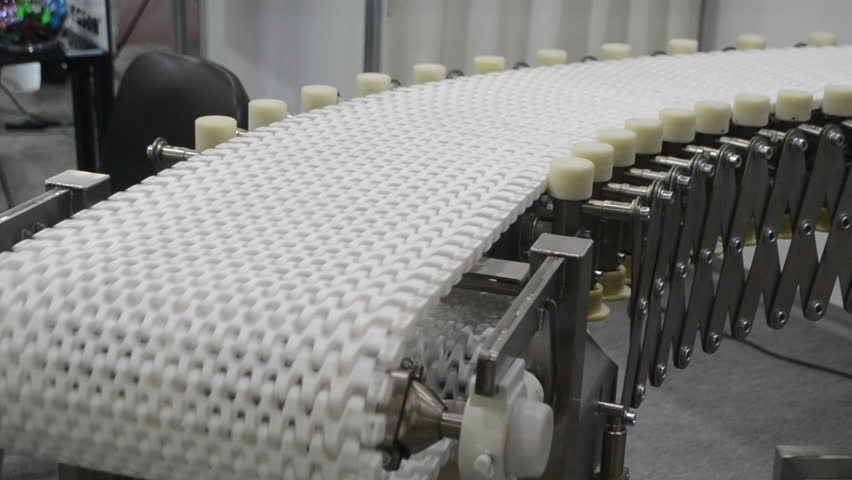 Modular belt rotary conveyor. Continuous movement system. Transportation of materials or products. Conveyors for moving objects. Production manufacture. Moving industrial belt. Connected plastic links